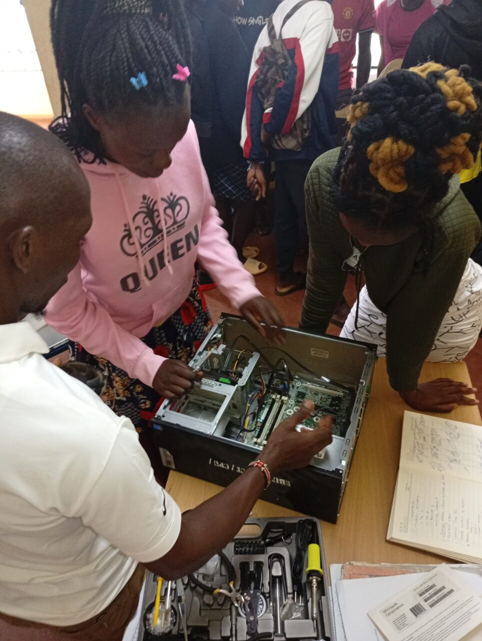 Trainees participating in hands-on learning at Ebukanga TVC